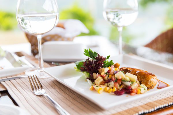 close up of food and water glasses at restaurant harbour balearics port de portocolom sa llotja